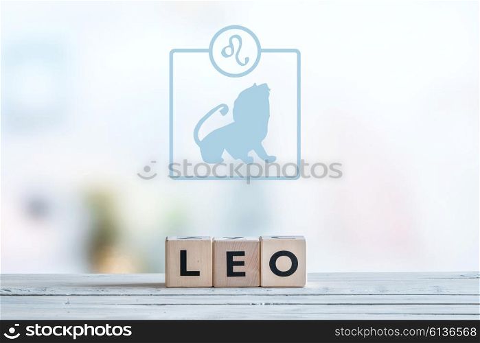Leo star sign on a wooden table