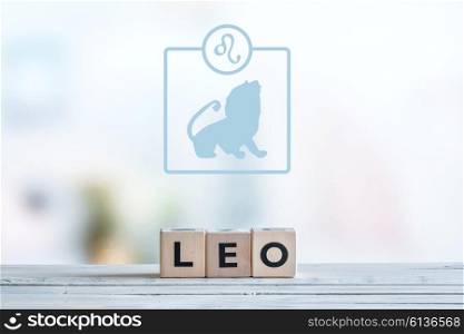Leo star sign on a wooden table