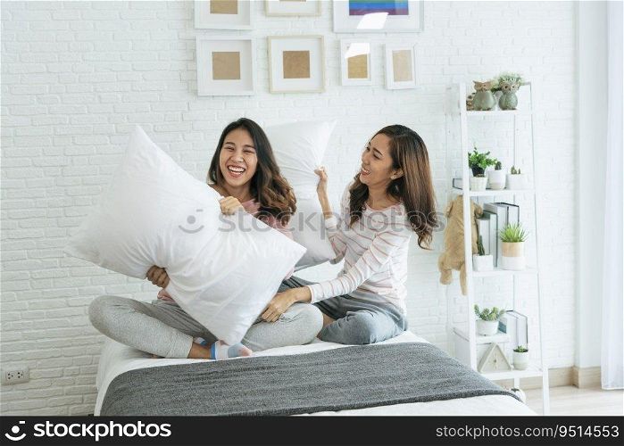 Lesbian couple homosexual happiness lifestyle on bed. Two pretty girlfriend talk, hug and laugh together relation fall in love. LGBTQ relation lifestyle concept.