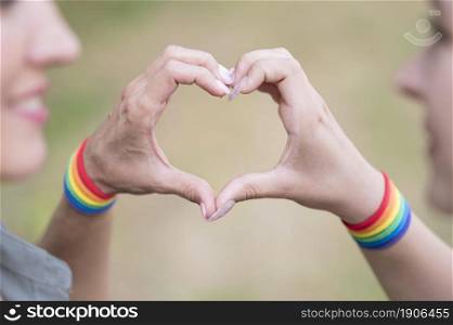 lesbian couple with lgbt bracelete. High resolution photo. lesbian couple with lgbt bracelete. High quality photo
