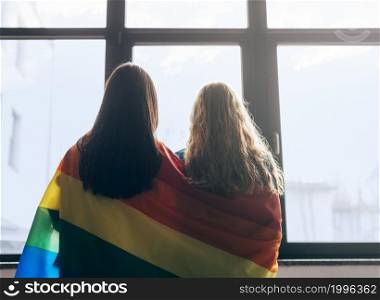 lesbian sweethearts wrapped lgbt flag