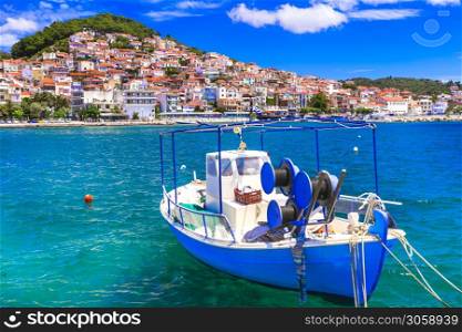 Lesbos (lesvos) island . Greece. view of Plomari (Plomarion) town and traditional fishing boat