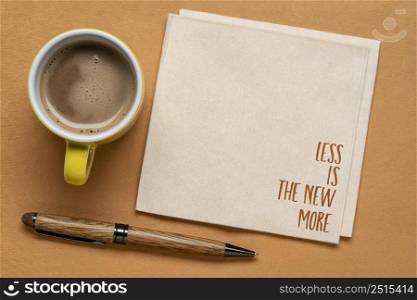 less is the new more - minimalism concept, handwriting on a napkin with a cup of coffee