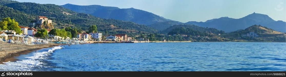 Lesvos island . Greece. Beautiful coastal village Petra with famous monastery on the rock and great beach