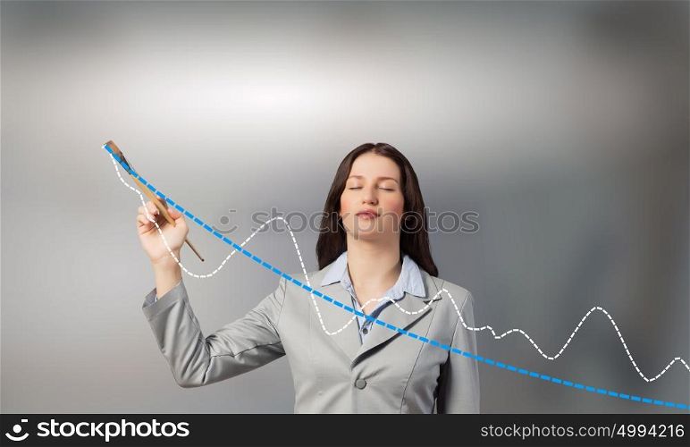 Let it your income go up. Young businesswoman drawing increasing graph with paint brush