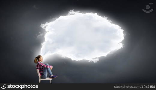 Let me think a minute. Teenager girl sitting in chair and cloud bubble above her head