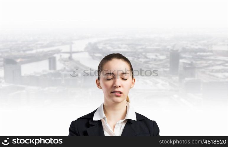 Let me think. Young businesswoman with closed eyes thinking something over