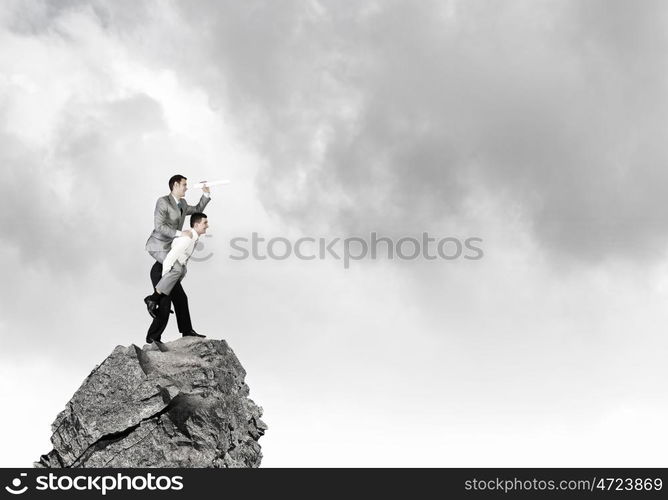 Let others work. Businessman riding on back of his colleague