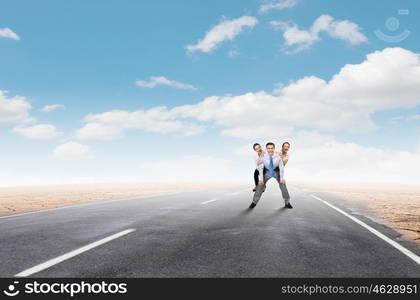 Let others work. Businesswomen riding on back of colleague businessman