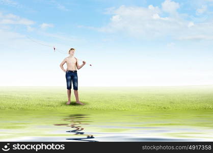 Let&rsquo;s go fishing. Boy of school age with fishing rod