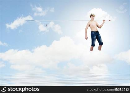 Let&rsquo;s go fishing. Boy of school age with fishing rod