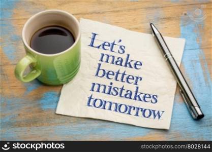 Let&rsquo;s make better mistakes tomorrow - handwriting on a napkin with a cup of espresso coffee