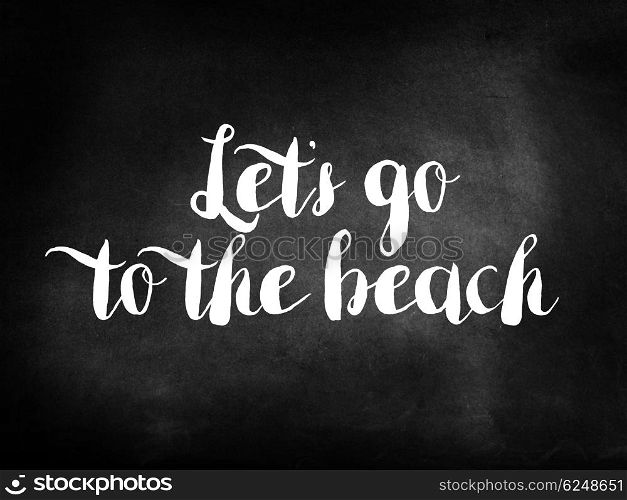 Let?s go to the beach written on a blackboard
