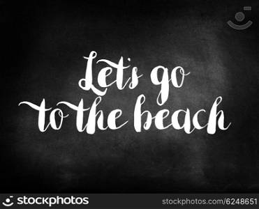 Let?s go to the beach written on a blackboard