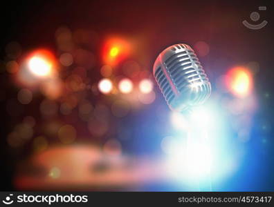 Let's sing! Stylish retro microphone on a colored background