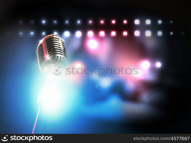 Let's sing! Stylish retro microphone on a colored background