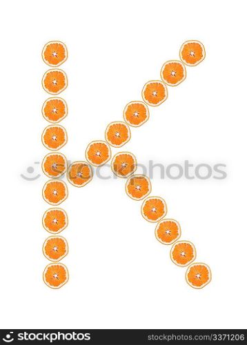 Letter &acute;K&acute; from orange slices isolated on white background