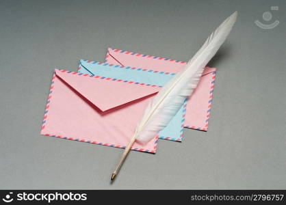 Letter and feather on the background