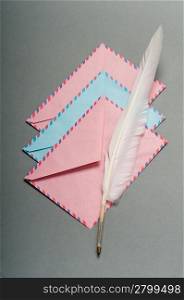 Letter and feather on the background