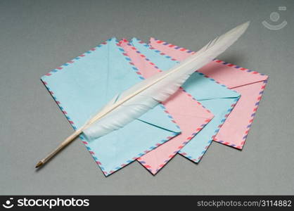 Letter and feather on the background