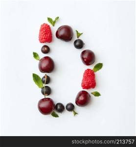 Letter D english alphabet in the form of a pattern of natural organic berries - ripe fresh raspberry, black currant, cherry, green mint leaf isolated on a white background. Top view.. Summer colorful pattern of letter D english alphabet from natural ripe berries - black currant, cherries, raspberry, mint leaf isolated on a white background. Top view.