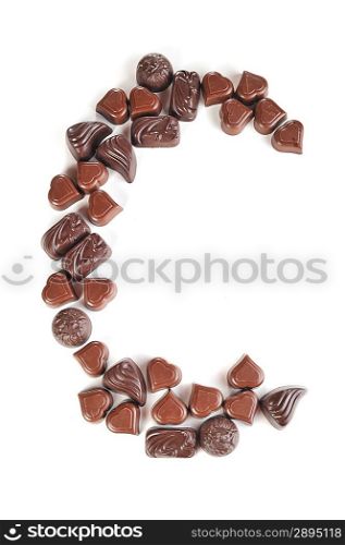 letter from chocolates on white background