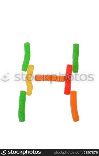 letter from gummy candies on white background