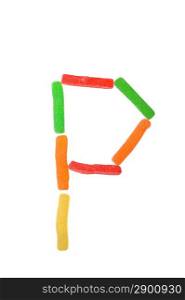 letter from gummy candies on white background