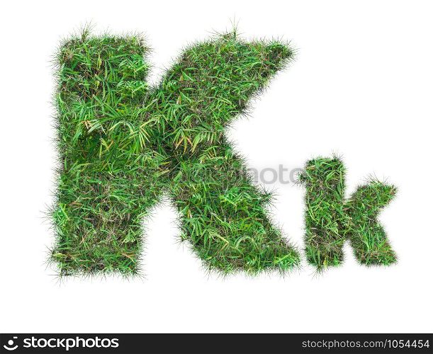 letter K on green grass isolated on over white background