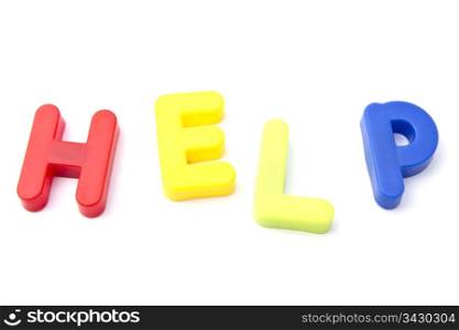 "Letter magnets "help" closeup on white background"