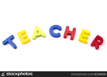 "Letter magnets " teacher" closeup on white background "