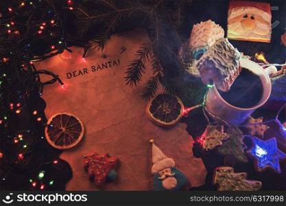 Letter to Santa. Letter for Santa on decorated chrismas background with gingerbread coocies and garland