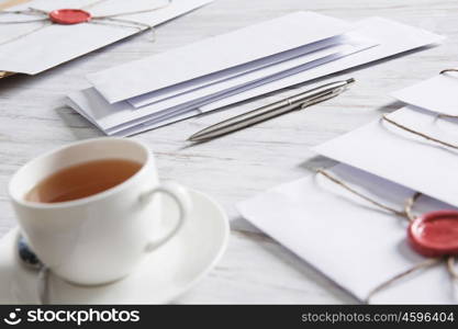 Letter with seal on table. Old post concept with envelope with wax seal on wooden surface