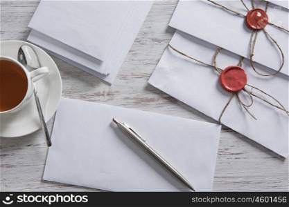 Letter with seal on table. Old post concept with envelope with wax seal on wooden surface