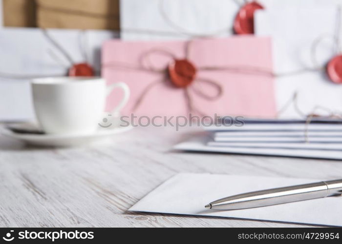 Letter with seal on table. Old post concept with envelope with wax seal on wooden surface