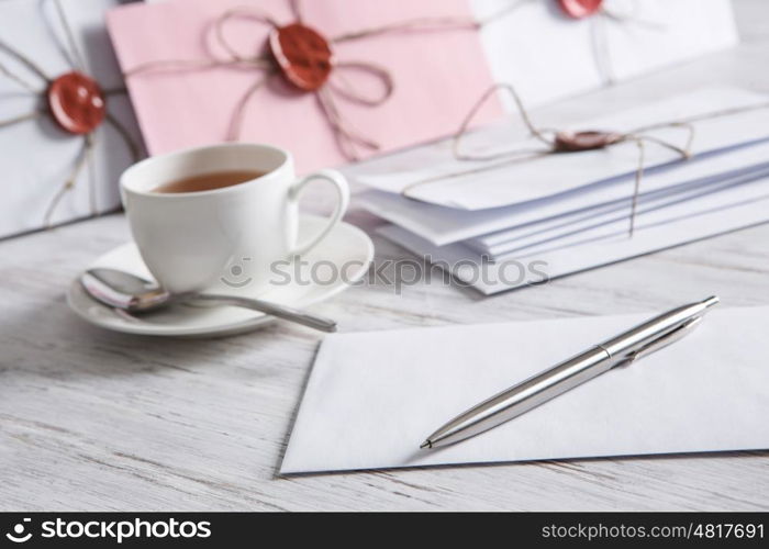 Letter with seal on table. Old post concept with envelope with wax seal on wooden surface