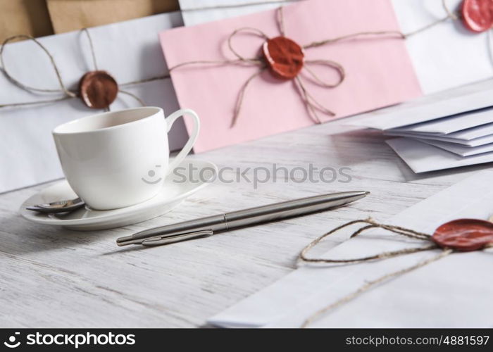 Letter with seal on table. Old post concept with envelope with wax seal on wooden surface