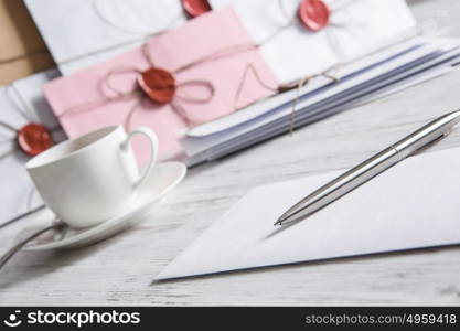 Letter with seal on table. Old post concept with envelope with wax seal on wooden surface