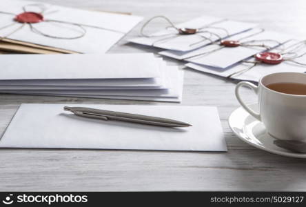 Letter with seal on table. Old post concept with envelope with wax seal on wooden surface