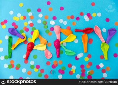 lettering, celebration and decoration concept - word party made of colorful balloons and confetti on blue background. word party made of colorful balloons and confetti