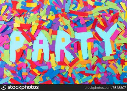 lettering, celebration and decoration concept - word party made of colorful confetti on blue background. word party made of confetti decoration on blue