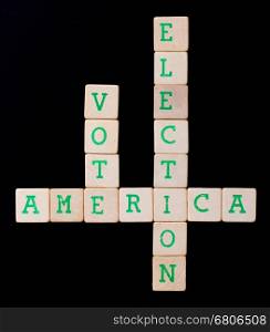 Letters on wooden blocks (America, vote, election)