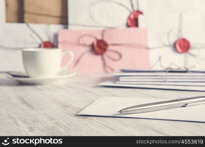 Letters with seal on table. Old post concept with envelope with wax seal on wooden surface