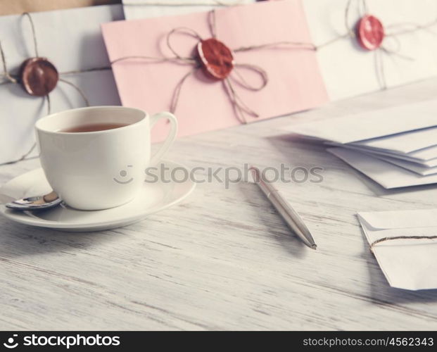 Letters with seal on table. Old post concept with envelope with wax seal on wooden surface