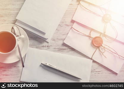 Letters with seal on table. Old post concept with envelope with wax seal on wooden surface