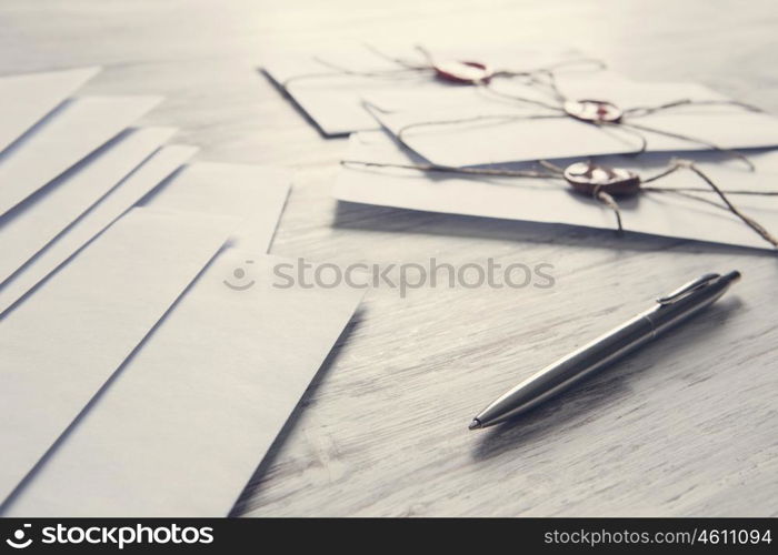 Letters with seal on table. Old post concept with envelope with wax seal on wooden surface