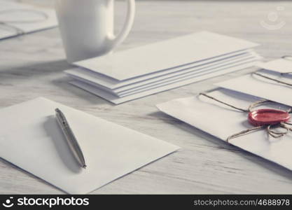 Letters with seal on table. Old post concept with envelope with wax seal on wooden surface