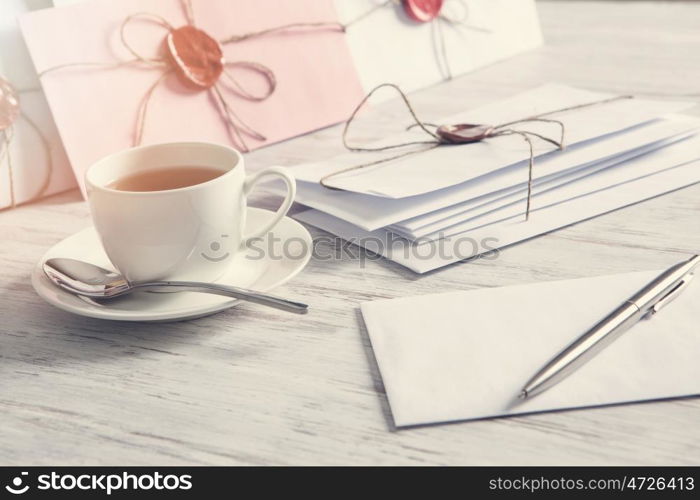 Letters with seal on table. Old post concept with envelope with wax seal on wooden surface