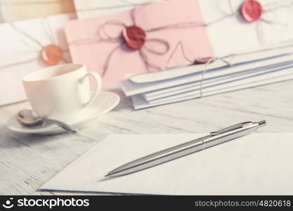 Letters with seal on table. Old post concept with envelope with wax seal on wooden surface