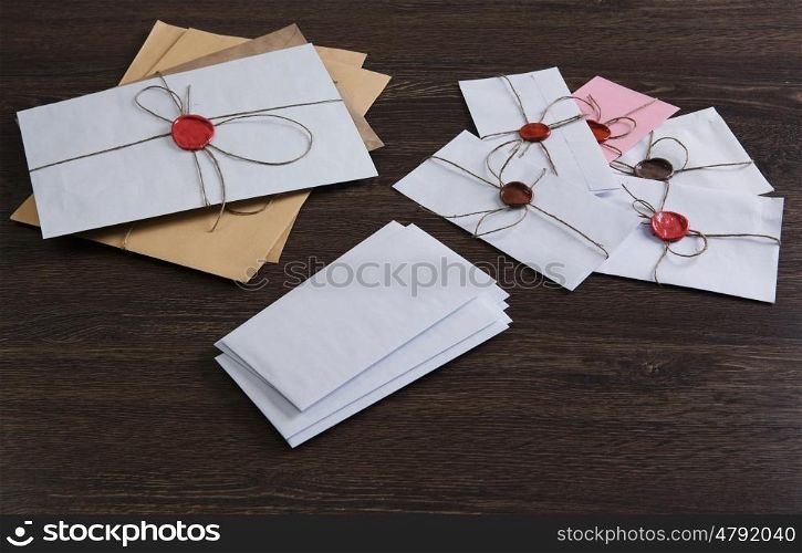 Letters with seal on table. Old post concept with envelopes with wax seal on wooden surface
